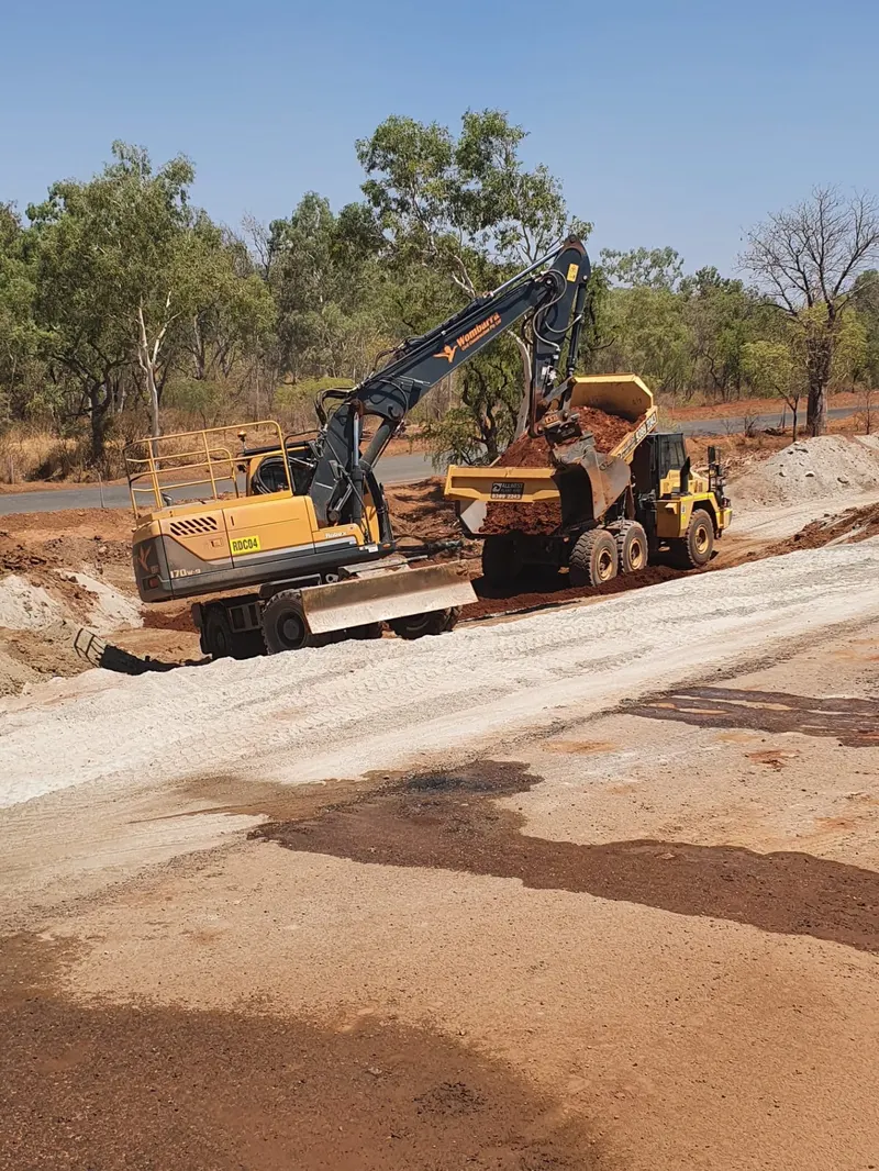 Wombarra loader working a road formation with an articulated dumper