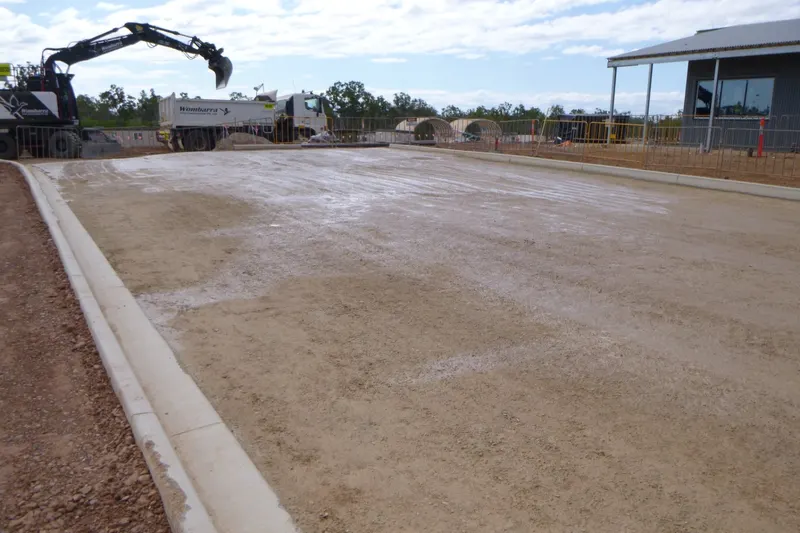 Kerbed pavement pad trimmed and prepared for sealing