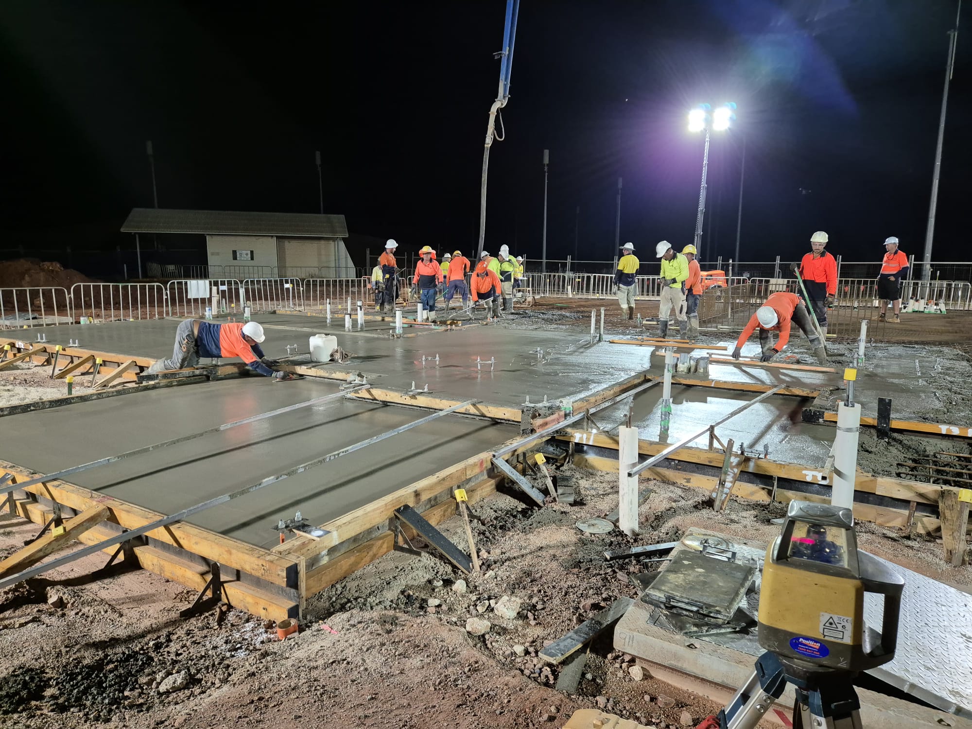 Wombarra night concrete pour with full crew screeding structural slab under lights