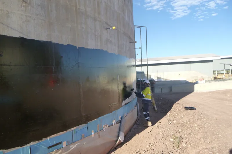 Brush applied bitumen tank wall