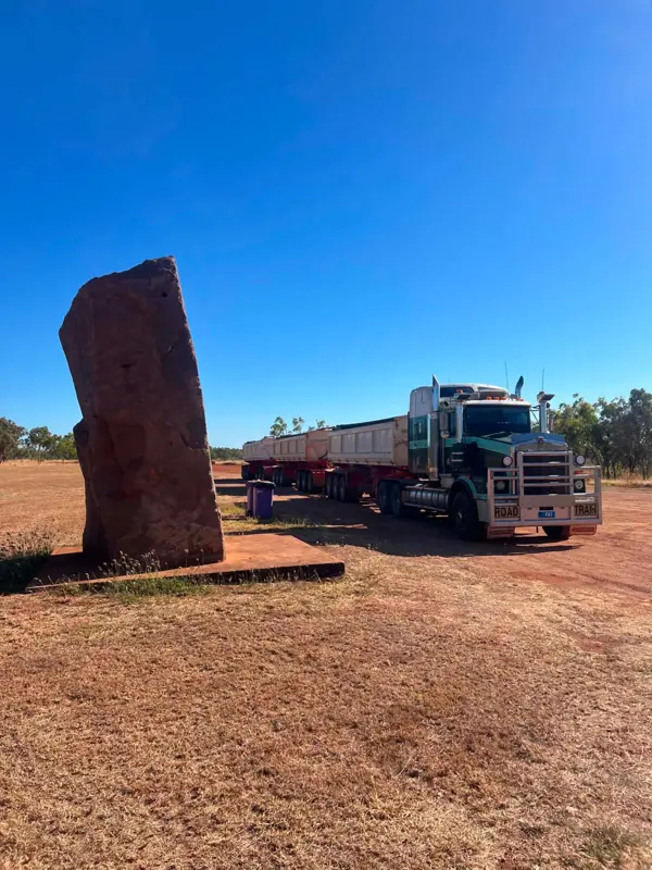 Kenworth road train with side tippers on an outback highway