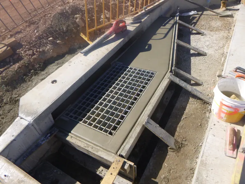 Concrete drain and grate installation