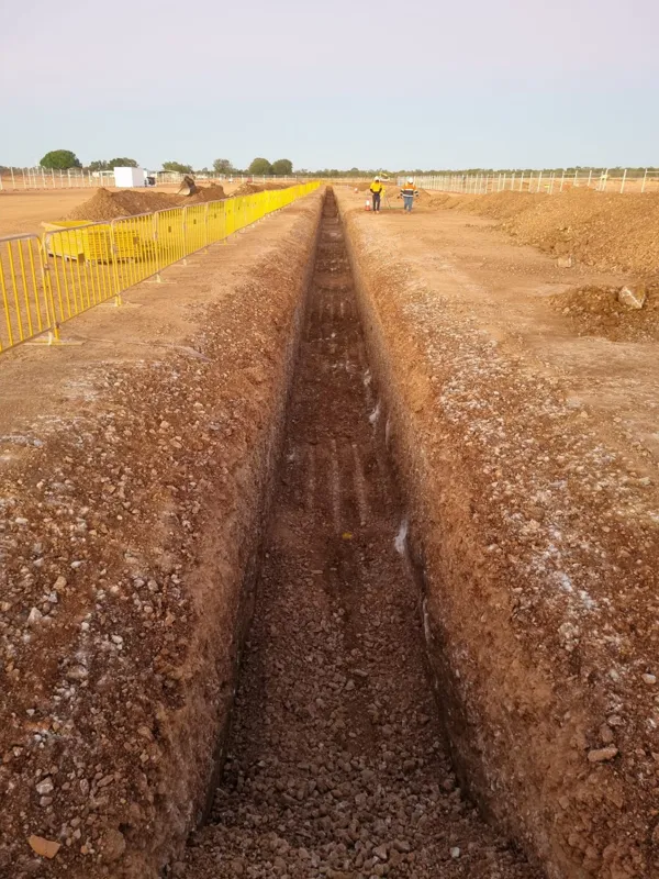 Long narrow trench survey crew