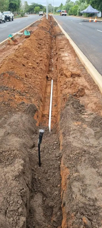 Conduit trench in a road median with kerb both sides