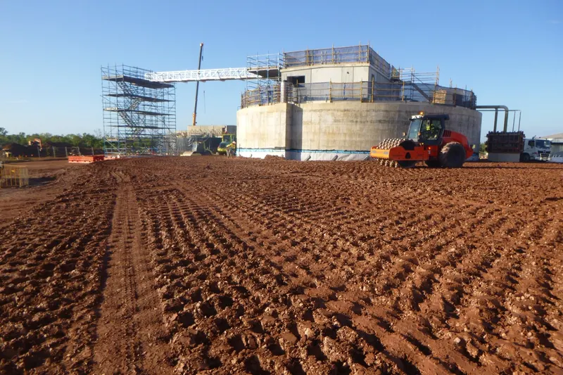 Padfoot roller compacting bulk fill around a concrete tank