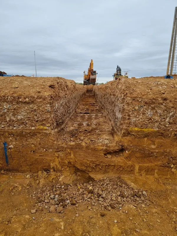 Deep benched trench twin excavators