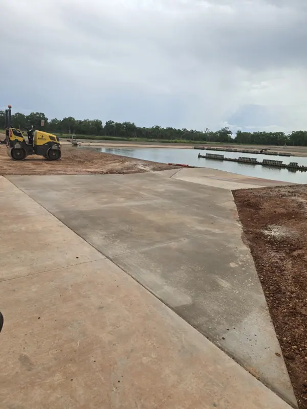 Finished concrete apron beside a water facility